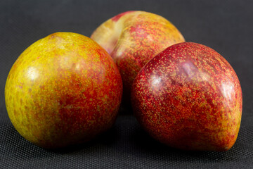 Sweet plums in close-up on a black background