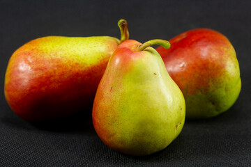 Sweet pears in close-up on a black background