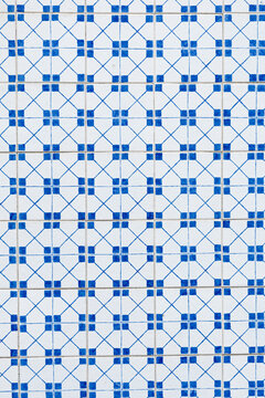 Squared style mosaic of tiles with navy colors traced with lines. Original from Portugal. 