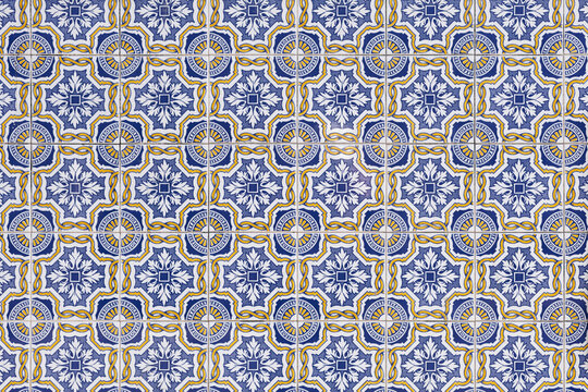 Highly detailed portuguese mosaic of tiles with complex navy patterns and flowers 