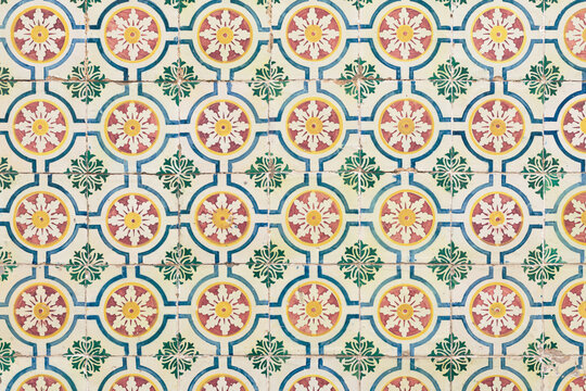 Original portuguese mosaic of tiles with colorful and geometric shapes inspired by summer and warm seasson