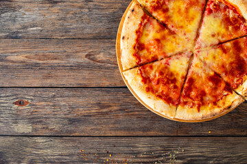 Margherita Pizza with tomato sauce and mozzarella cheese on wooden background
