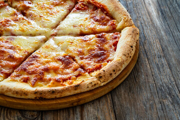 Margherita Pizza with tomato sauce and mozzarella cheese on wooden background
