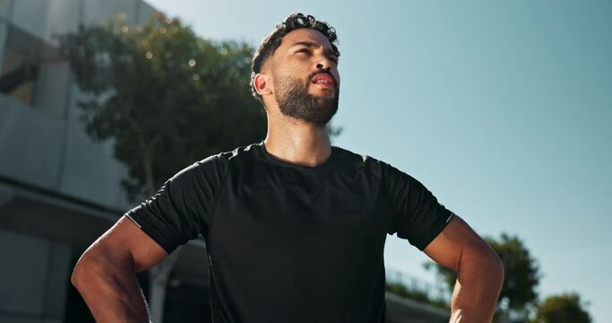 City, tired and man with fitness, sweating and exhausted with workout and challenge with training. Outdoor, athlete and runner with break or sunshine with wellness and fatigue with progress or health