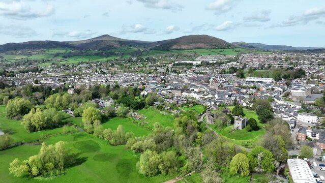 Aerial view of the historic town of Abergavenny and the landmark known as Sugar Loaf Mountain in Monmouthshire, South Wales, UK