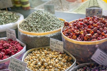 Dried traditional garments and spices at Souq Waqif in Doha, Qatar. There are chamomile, banana, rose flowers and others, many of which are product of Iran. 