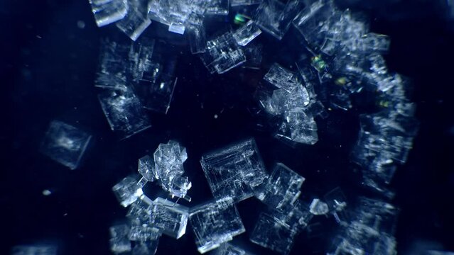 Glowing blue growing crystal macro close up time lapse