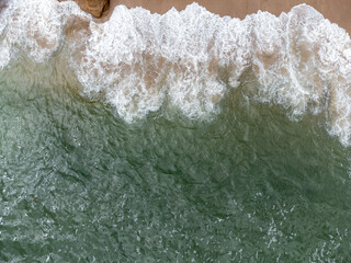 beautiful beach with green waters seen from above