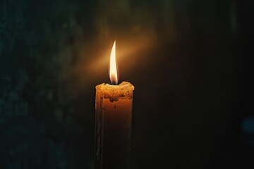 Single candle flame flickering in the vast darkness - obrazy, fototapety, plakaty