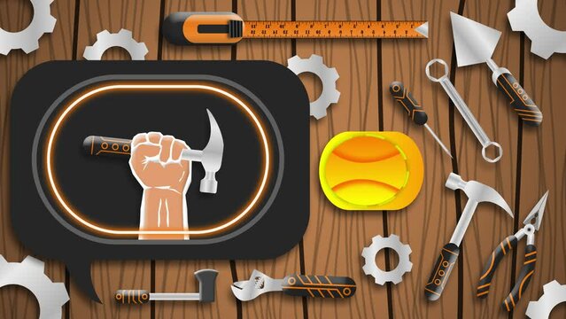Hand holding hammer in bright blinking light on wooden desk with labour tools and safety halmet. Concept for international labour day on first may.