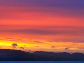 Fototapeta premium Fiery Dawn Clouds on an April Sunrise over the Jurassic Coast