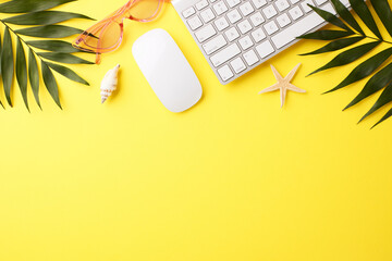 Top view of a tropical summer workspace with palm leaves on a bright yellow background - Powered by Adobe