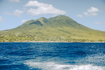 Charlestown, St Kitts and Nevis - March 28, 2028: Landscapes around Nevis Peak seen from the water in Saint Kitts and Nevis
