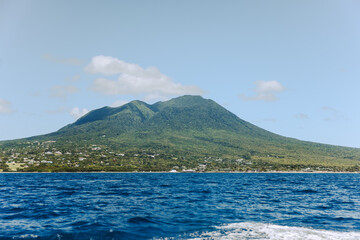 Charlestown, St Kitts and Nevis - March 28, 2028: Landscapes around Nevis Peak seen from the water in Saint Kitts and Nevis
