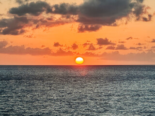 Basseterre, Saint Kitts - March 28, 2024: The sunset off the shore of Saint Kitts from the water
