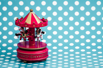 Vintage red carousel on a blue polka dotted background.