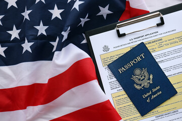 Department of State form DS11 Application for a U.S. Passport lies on table and ready to fill close...