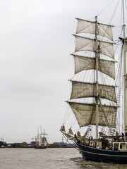 Fototapeta premium The front masts of a Majestic, tall ship, sailing down the River Thames in the Greater London, UK