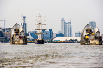 A tall ship passing throughthe gate formed by the Thames Barrier, during the tall ship Festival in...