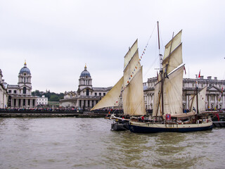 A relatively small Two-masted sailing vessel on the River Thames at Greenwich in the Greater London, UK, during the Tall ship festivaL © Marieke