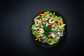 salad with squid, fresh cucumber, eggs, sweet pepper, red onion, with dressing, homemade, no people,