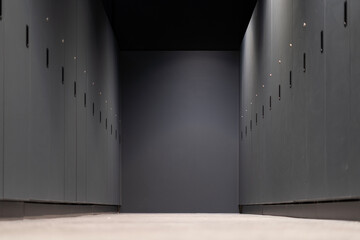 A row of closed gray cabinets in a corridor
