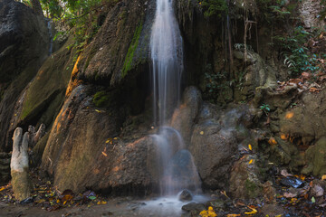 Fototapeta na wymiar Waterfall in autumn forest