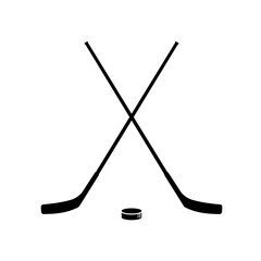 Hockey. Two crossed hockey sticks and puck - vector illustration - obrazy, fototapety, plakaty