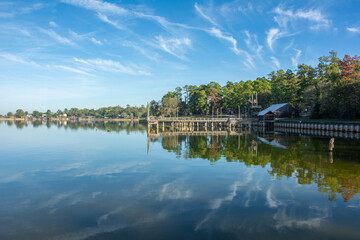 Serene view of Lake Livingston reservoir with nice coulds reflecting in  still waters in the East Texas Piney Woods in Polk County, Texas, United States