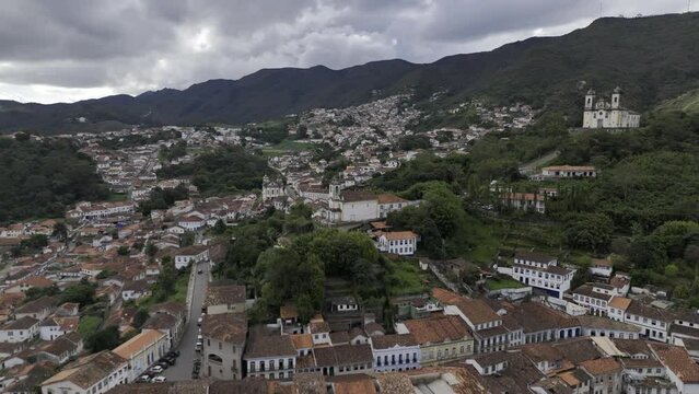 Drone orbits to the left in front of Igreja de Sao Jose Antiga Capela Imperial down the hill from Church of Saint Francis of Paola