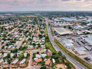 aerial view of residential and industrial area split by a road in Gaborone the capital of Botswana