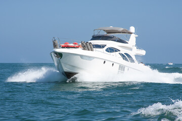 White yacht sailing in a calm sea