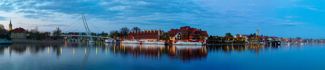  2023-04-28; panorama Mikolajskie Lake of town, marina for yachts and boats at the waterfront....