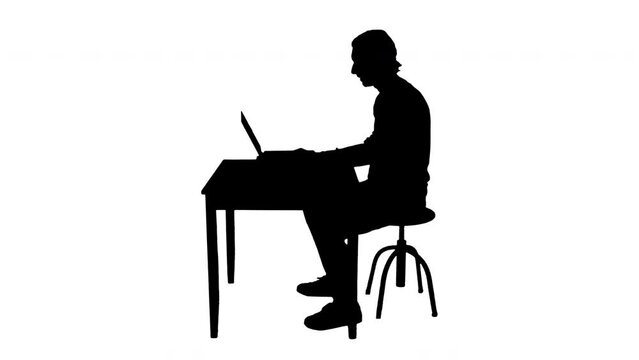 Male Silhouette Using Computer Virtual Friends Chat Profile Shot. Silhouette of a man talking with virtual friends on the laptop camera. Profile shot