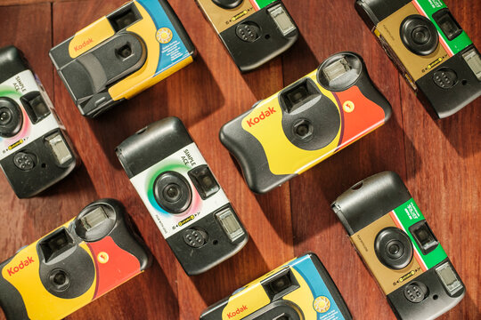 Top down shot background of Kodak and Fujifilm disposable camera on floor