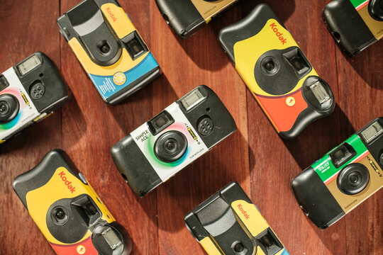Top down shot background of Kodak and Fujifilm disposable camera on floor