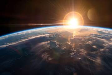 view of blue planet Earth from space with sun setting over horizon, sunrise