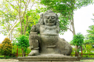 Fototapeta na wymiar Totok Kerot statue in Kediri. This statue is a 3m tall inscription in the form of a giant statue of Dwarapala, which originates from the kingdom of Kediri.