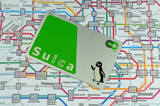 Suica IC Metro prepaid travel card on a train map of Tokyo. London - 2nd October 2021