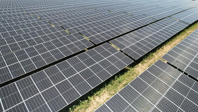 Modern 2024 Solar farm with solar panels during construction. You can clearly see new components and layout type
