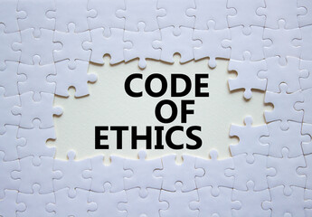 Code of ethics symbol. Concept words Code of ethics on white puzzle. Beautiful white background....