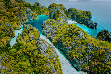 Aerial drone view beautiful shallow tropical Big and Small Lagoon explored inside by tourist on...