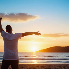 Happy man raising arms up enjoying sunset on the beach - Delightful traveler standing with hands up looking morning sunrise - traveling, wellness and healthy life style concept