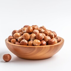 Hazelnuts in a wooden plate isolate on white background, close up, copy space