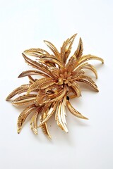 Elegant gold flower brooch on white background. Perfect for fashion or jewelry design projects - obrazy, fototapety, plakaty