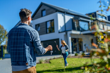 Naklejka premium New Homeowner Receives Keys from Real Estate Agent