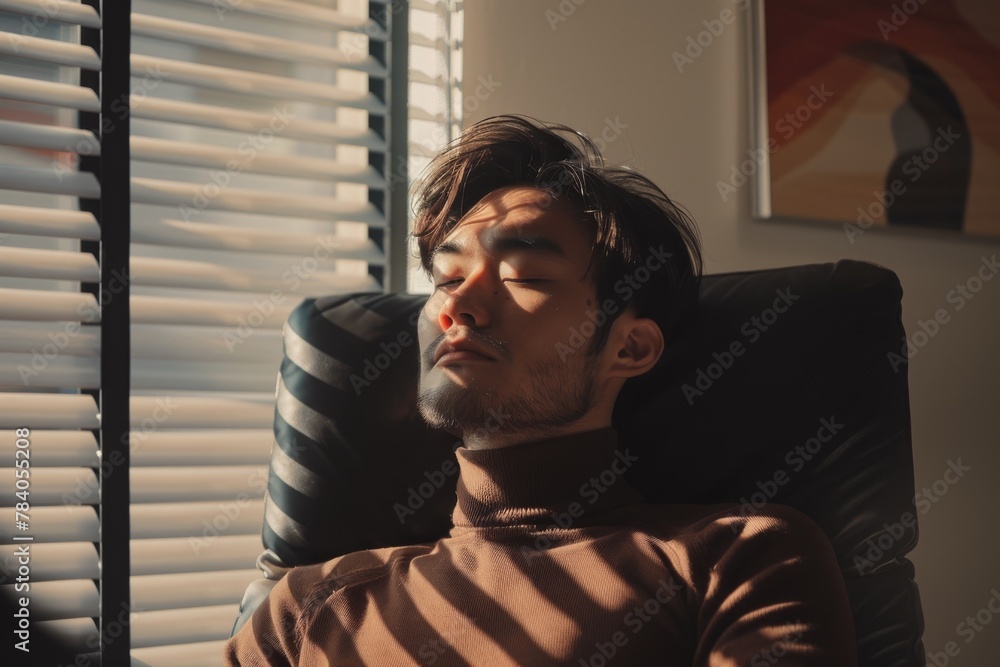 Aufkleber a serene scene with a man in casual attire seated comfortably by a window with the sun casting shado