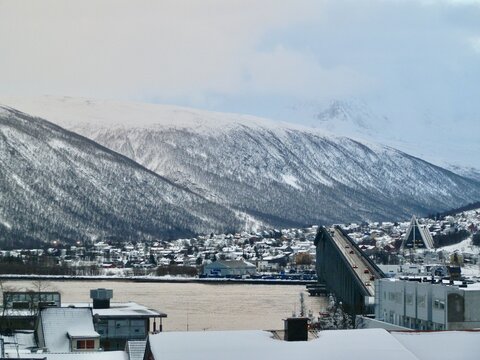 The city of Tromso sits in the valley of the Tromsdalstinden mountain and is connected to mainland Norway via the Tromso Bridge.