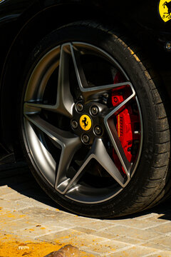 Ferrari F8 satin grey wheel, red brake caliper, yellow hubcap, Italian Sportscar detail