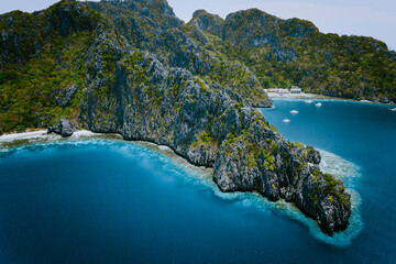 Miniloc Island with limestone cliffs. Aerial drone panoramic picture. Bacuit Archipelago, El Nido,...